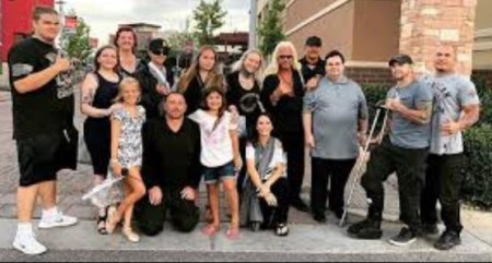 A picture of Garry Chapman with his father, siblings, and other family members. at his mother's memorial.